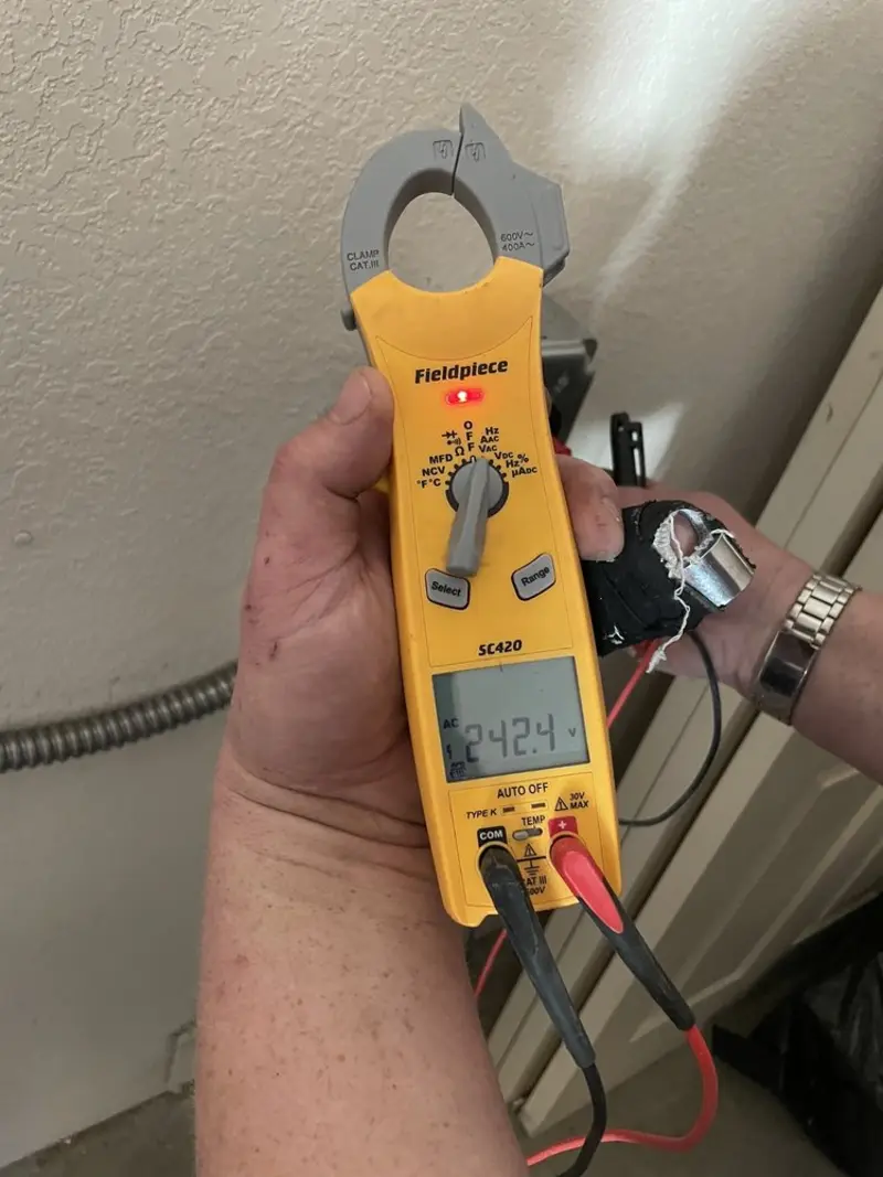Voltage testing with clamp meter during Ceiling Fan Installation in Shorewood